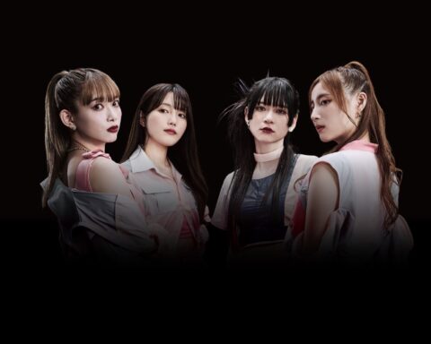 Promotional photo for "GROUNDSWELL" which sees the four band members of PassCode surrounded by darkness while their faces are spotlighted, with two of the women looking at the camera over their shoulders.